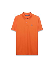 Men's Classic Pima Pique Polo in vibrant orange, featuring a classic fit, textured pique fabric, and a small embroidered white and black Psycho Bunny skull logo on the left chest with white buttons. (5)
