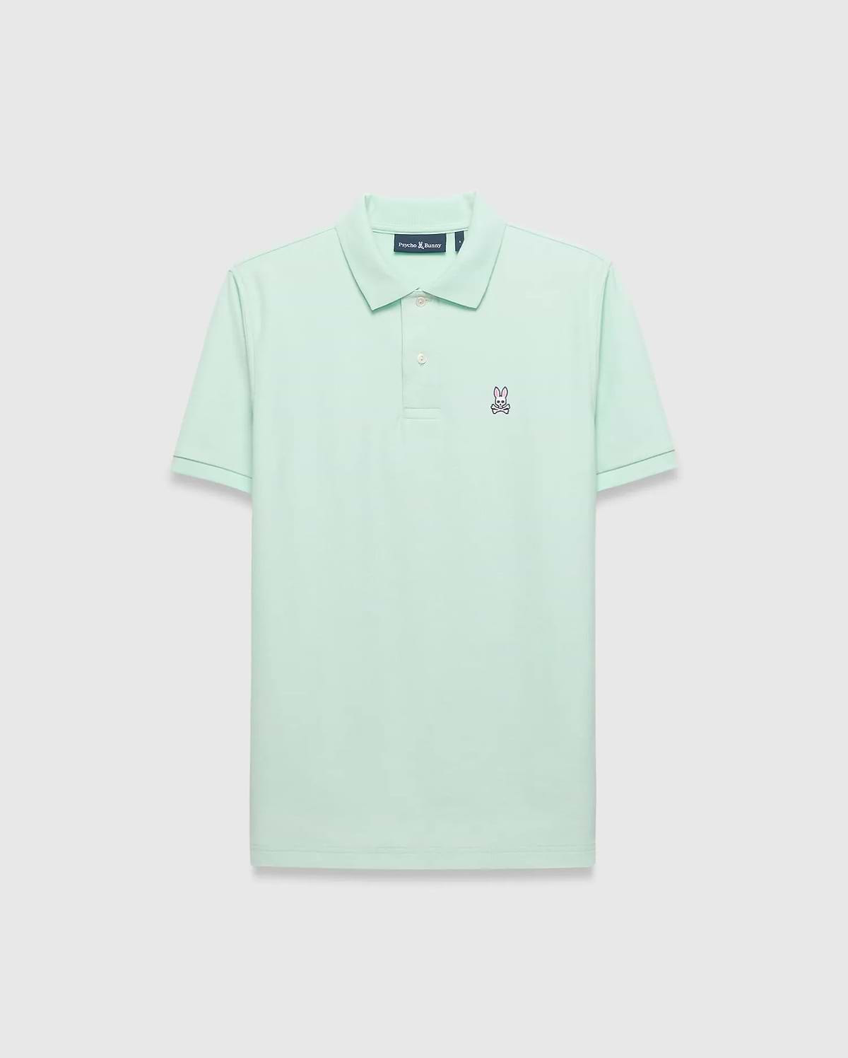Mens Classic Pique Polo in mint green, featuring a classic fit and pique texture. Small embroidered pink and navy Psycho Bunny skull logo on the left chest with white buttons. (2)