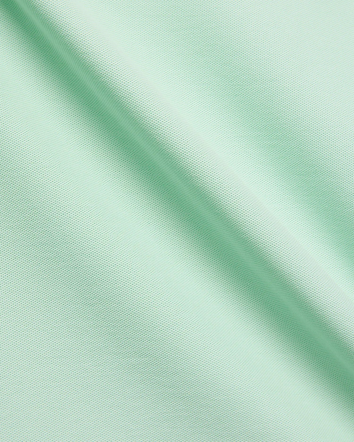 Vibrant Mint Green MENS CLASSIC PIQUE POLO fabric, showcasing its distinctive textured pique knit, soft drape, and premium quality, ideal for refined streetwear. (6)