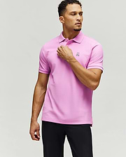 Mens Classic Pique Polo in vibrant pink, featuring a classic fit, textured pique fabric, and a small, embroidered white Psycho Bunny skull logo on the left chest with white buttons.