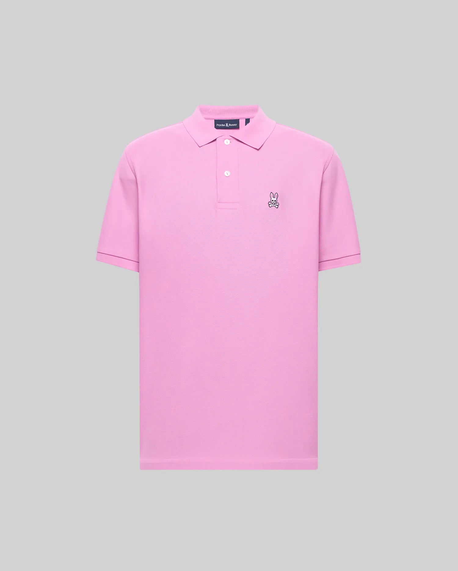 Mens Classic Pique Polo in vibrant pink, featuring a classic fit, pique knit texture, two white buttons, and a small black and white embroidered Psycho Bunny skull logo on the left chest.