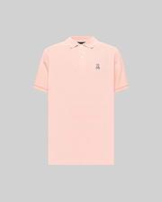 Mens Classic Pique Polo in peach, featuring a classic fit, pique knit texture, two-button placket, and a small embroidered purple, white, and black Psycho Bunny skull logo on the left chest with subtle red cuff tipping.