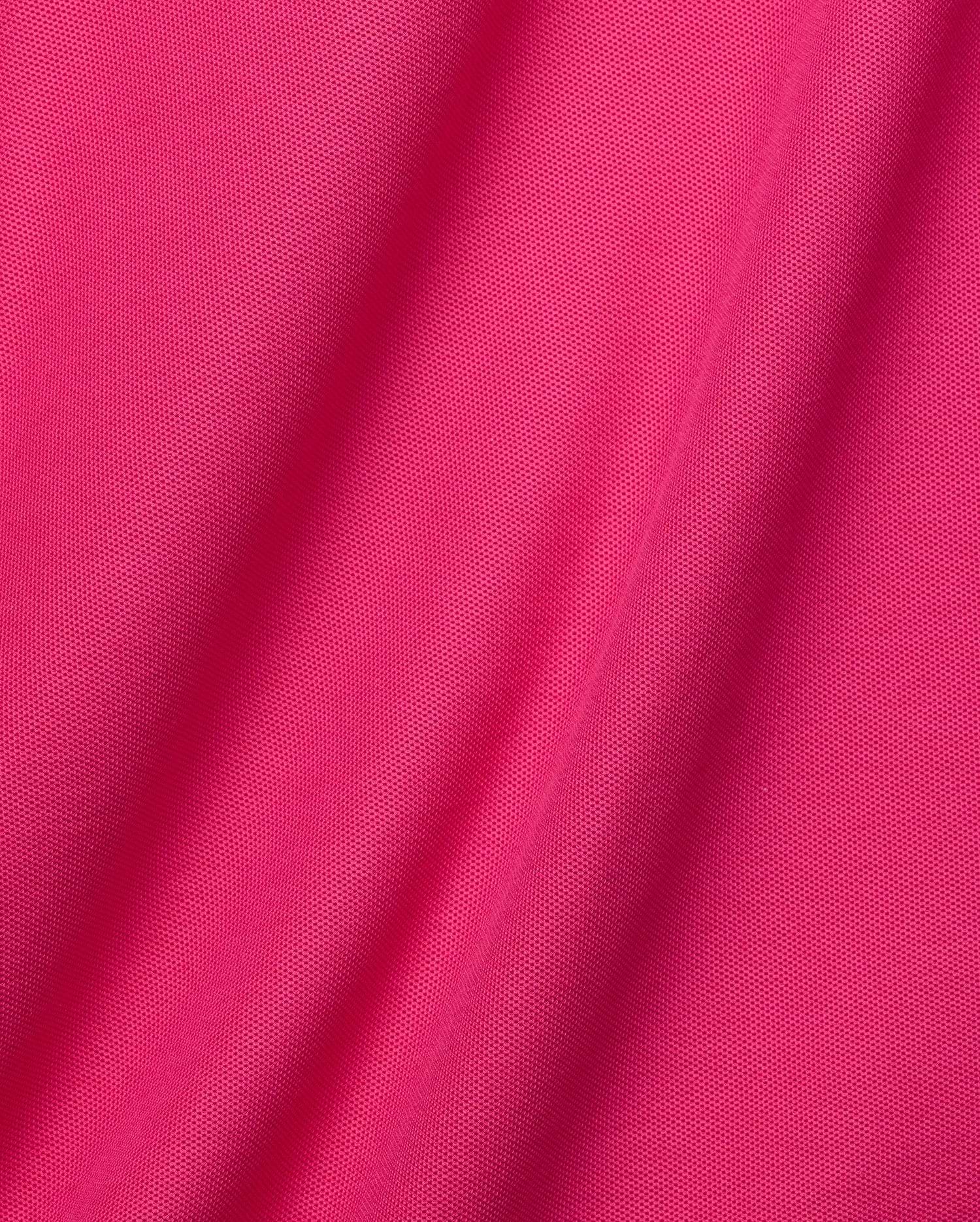 Mens Classic Pique Polo in vibrant fuchsia, crafted from breathable textured pique fabric. Features a classic fit and the iconic small embroidered Psycho Bunny skull logo on the left chest, embodying refined streetwear. (6)