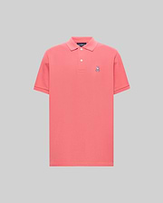 Mens Classic Pique Polo in vibrant coral, featuring a classic fit, pique knit texture, two-button placket, and a small embroidered white and navy Psycho Bunny skull logo on the left chest.