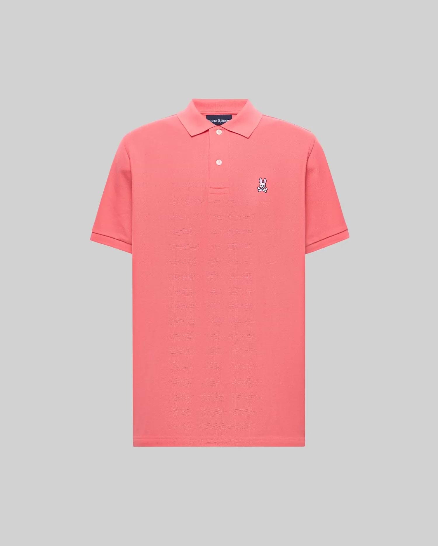 Mens Classic Pique Polo in vibrant coral, featuring a classic fit, pique knit texture, two-button placket, and a small embroidered white and navy Psycho Bunny skull logo on the left chest.
