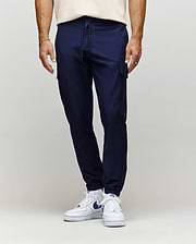 Mens Lloyd Cargo Jogger in navy blue, featuring a slim, tapered fit, smooth fabric, side cargo pockets, and a black and white drawstring waist with ribbed cuffs.