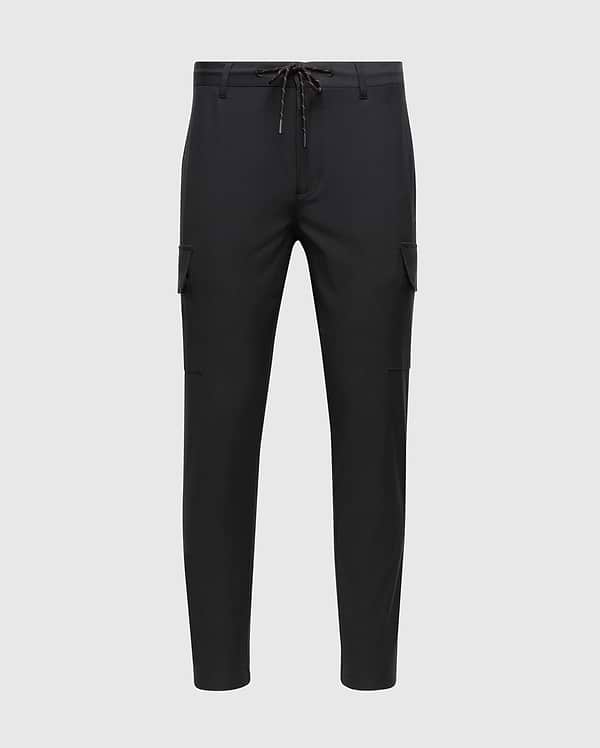 The MENS LLOYD CARGO JOGGER - B6P159B200 by Psycho Bunny are black with a slim fit design, featuring elasticized cuffs and an adjustable drawstring waistband. These joggers have utilitarian pockets on the sides and offer a sleek, modern look. The product is showcased against a white background.