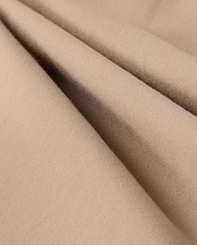 Close-up of beige fabric with a soft, smooth texture and subtle folds. The material appears lightweight and finely woven, suggesting it could be used for clothing or upholstery. The color and texture give a cozy and comfortable impression, making it perfect for the Psycho Bunny MENS LLOYD CARGO JOGGER - B6P159B200's snap fastening pockets.