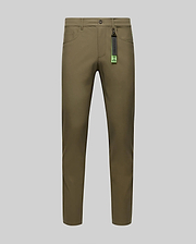The Psycho Bunny MENS MAVERICK 10K STEP PANT - B6P788D200 in olive green is shown front-facing on a gray background, with slim fit, button and zipper closure, five pockets, belt loops, and a black tag with green accents on the belt loop.
