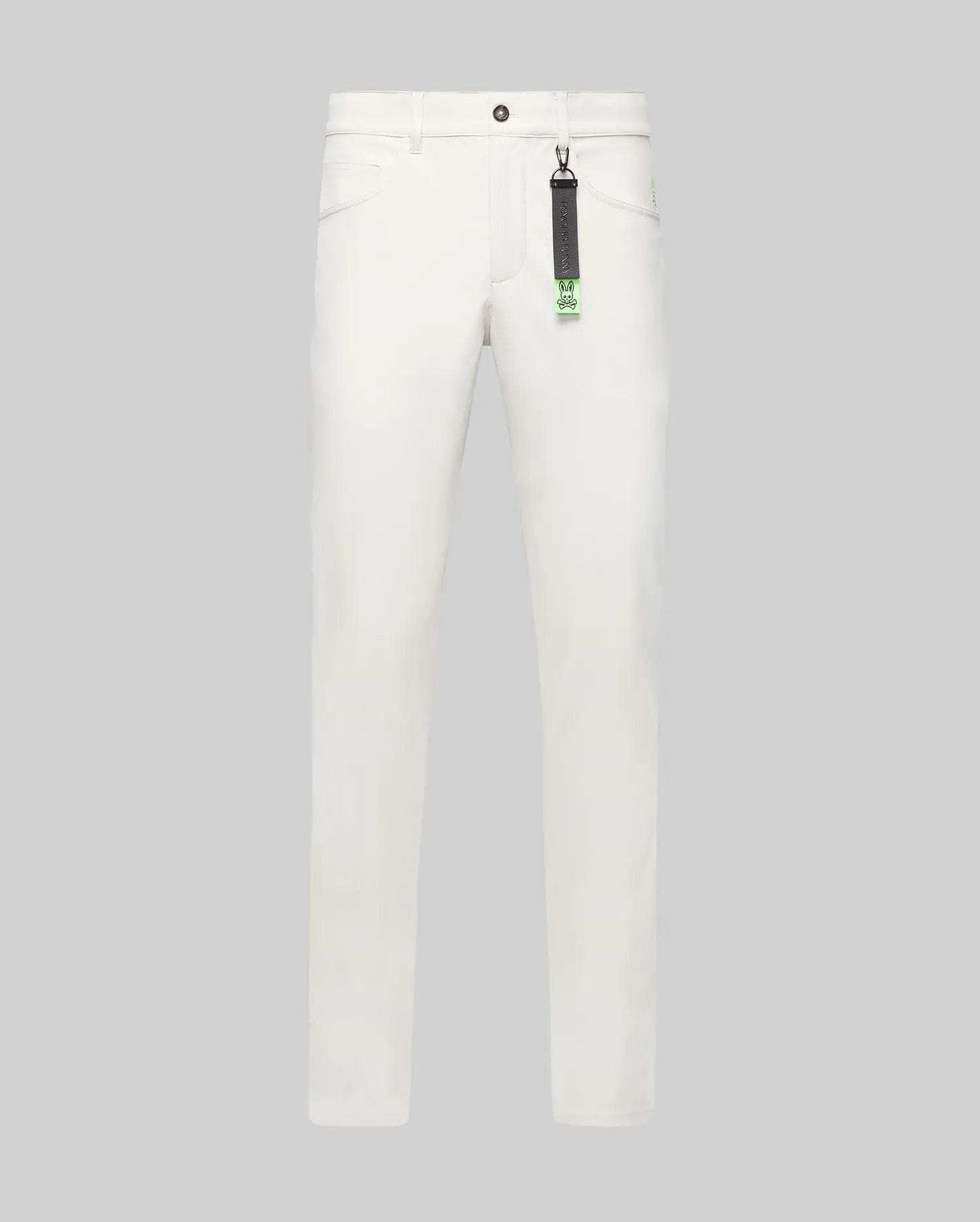 Mens Maverick 10k Step Pant in white, featuring a straight fit, smooth fabric, and a small embroidered neon green Psycho Bunny skull logo on the right hip. A black and neon green branded keychain hangs from a belt loop.