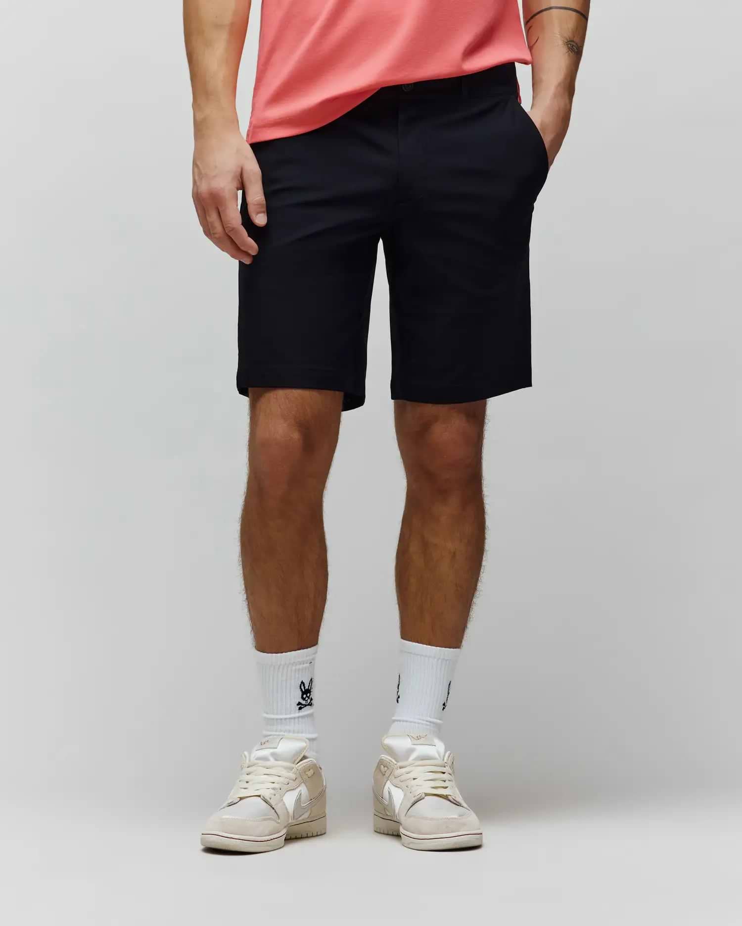 Mens Maverick 10k Step Short, a classic fit black performance stretch short with a smooth, refined finish, featuring a flat front, belt loops, slash pockets, and an above-the-knee length.