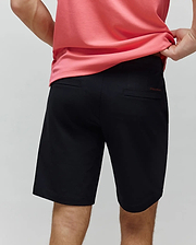 Black Mens Maverick 10k Step Short, a classic fit performance short with smooth fabric and a subtle red embroidered Psycho Bunny text logo on the back right welt pocket.
