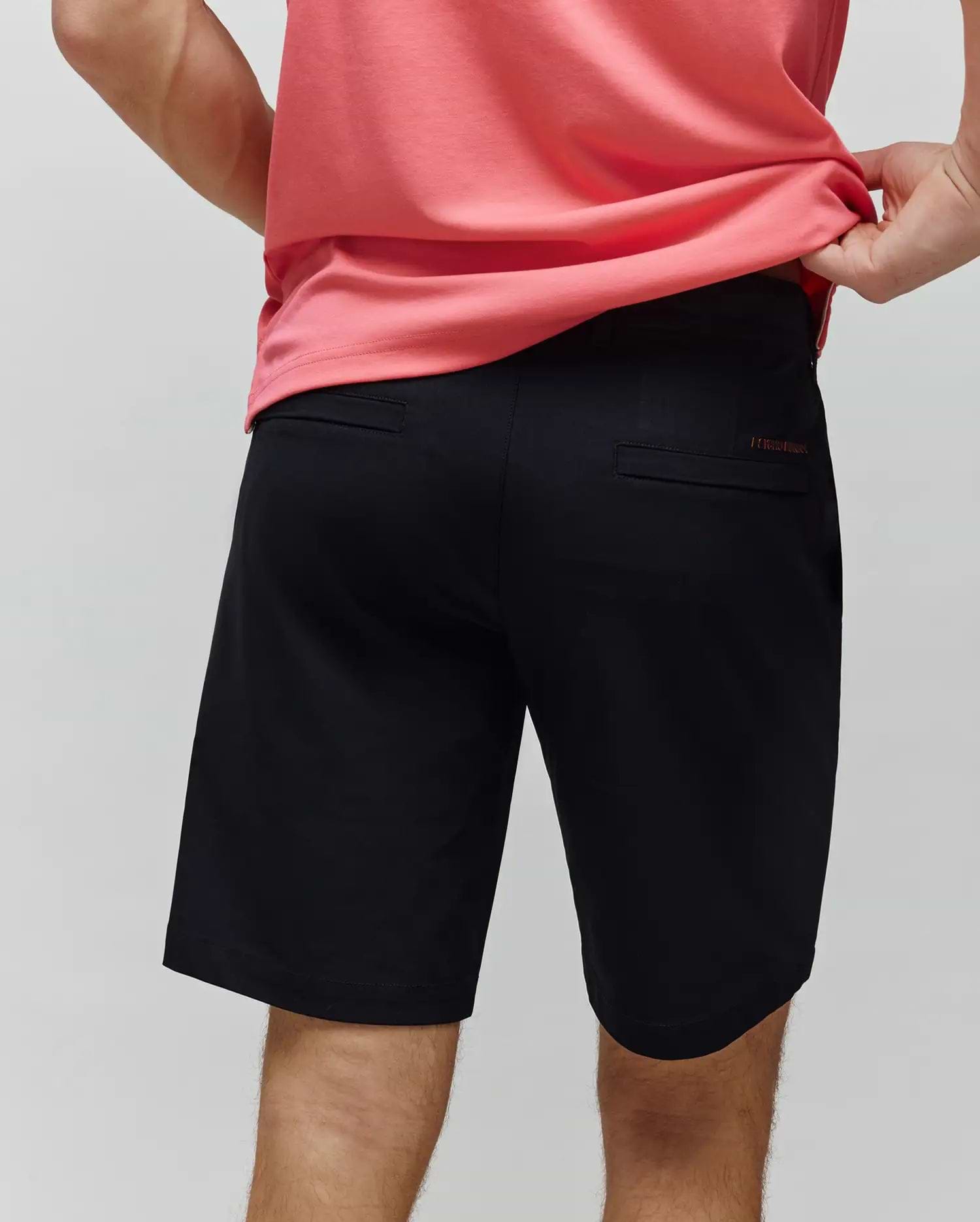 Black Mens Maverick 10k Step Short, a classic fit performance short with smooth fabric and a subtle red embroidered Psycho Bunny text logo on the back right welt pocket.