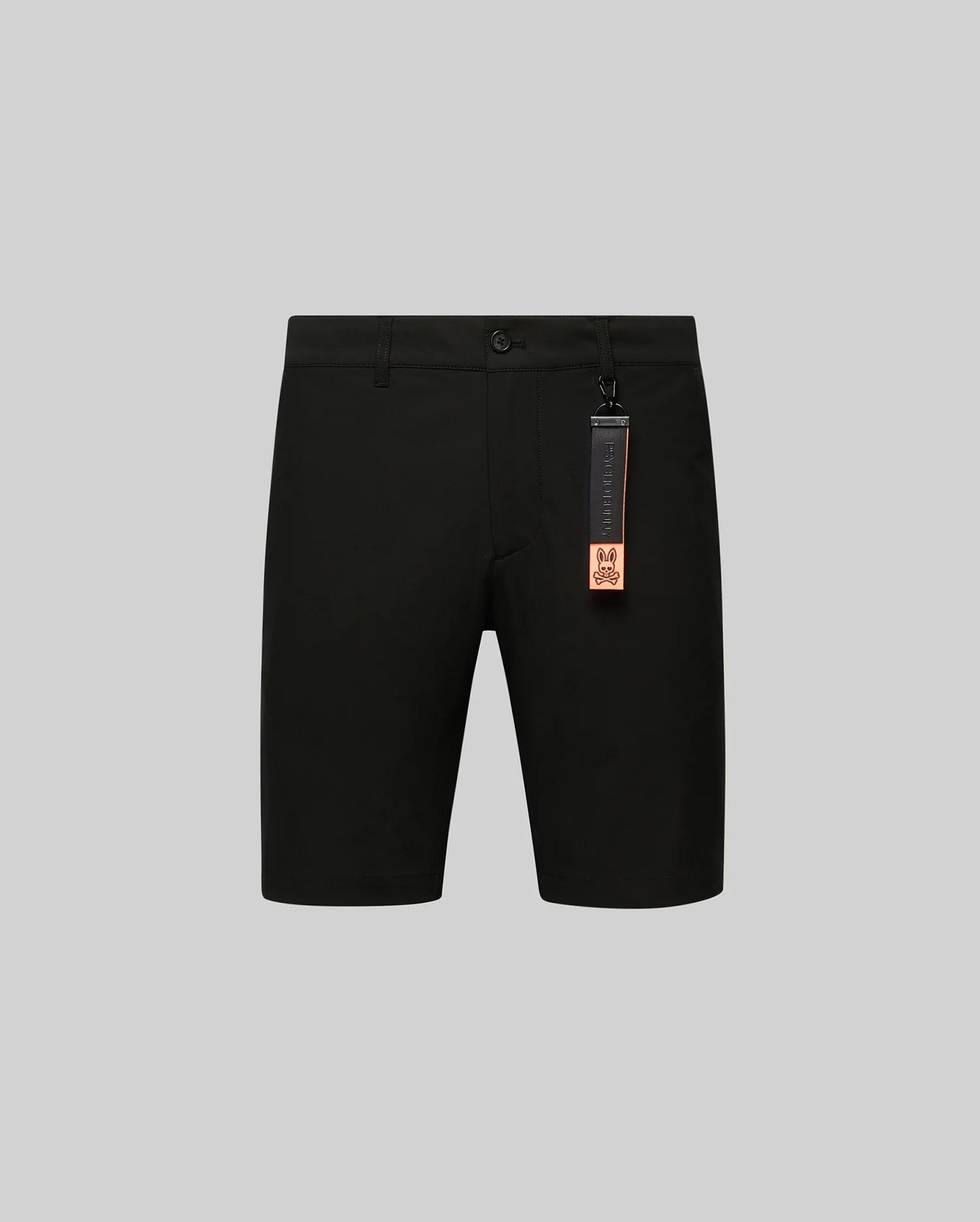 Black Mens Maverick 10k Step Short, featuring a smooth fabric, classic fit, and a distinctive orange and black Psycho Bunny skull logo tag attached to a belt loop.