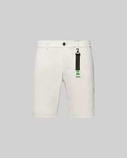 Cream Mens Maverick 10k Step Short, classic fit, smooth woven fabric, featuring button closure, belt loops, and a distinctive black and neon green Psycho Bunny skull logo keychain.