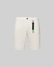 Cream Mens Maverick 10k Step Short, classic fit, smooth woven fabric, featuring button closure, belt loops, and a distinctive black and neon green Psycho Bunny skull logo keychain.