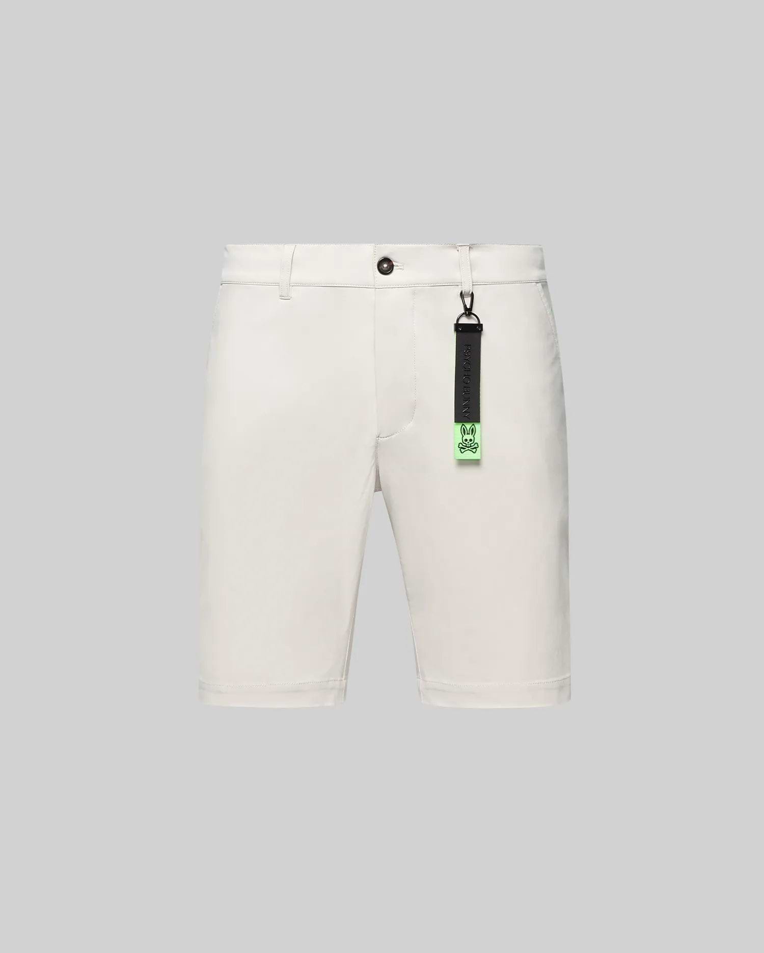 Cream Mens Maverick 10k Step Short, classic fit, smooth woven fabric, featuring button closure, belt loops, and a distinctive black and neon green Psycho Bunny skull logo keychain.