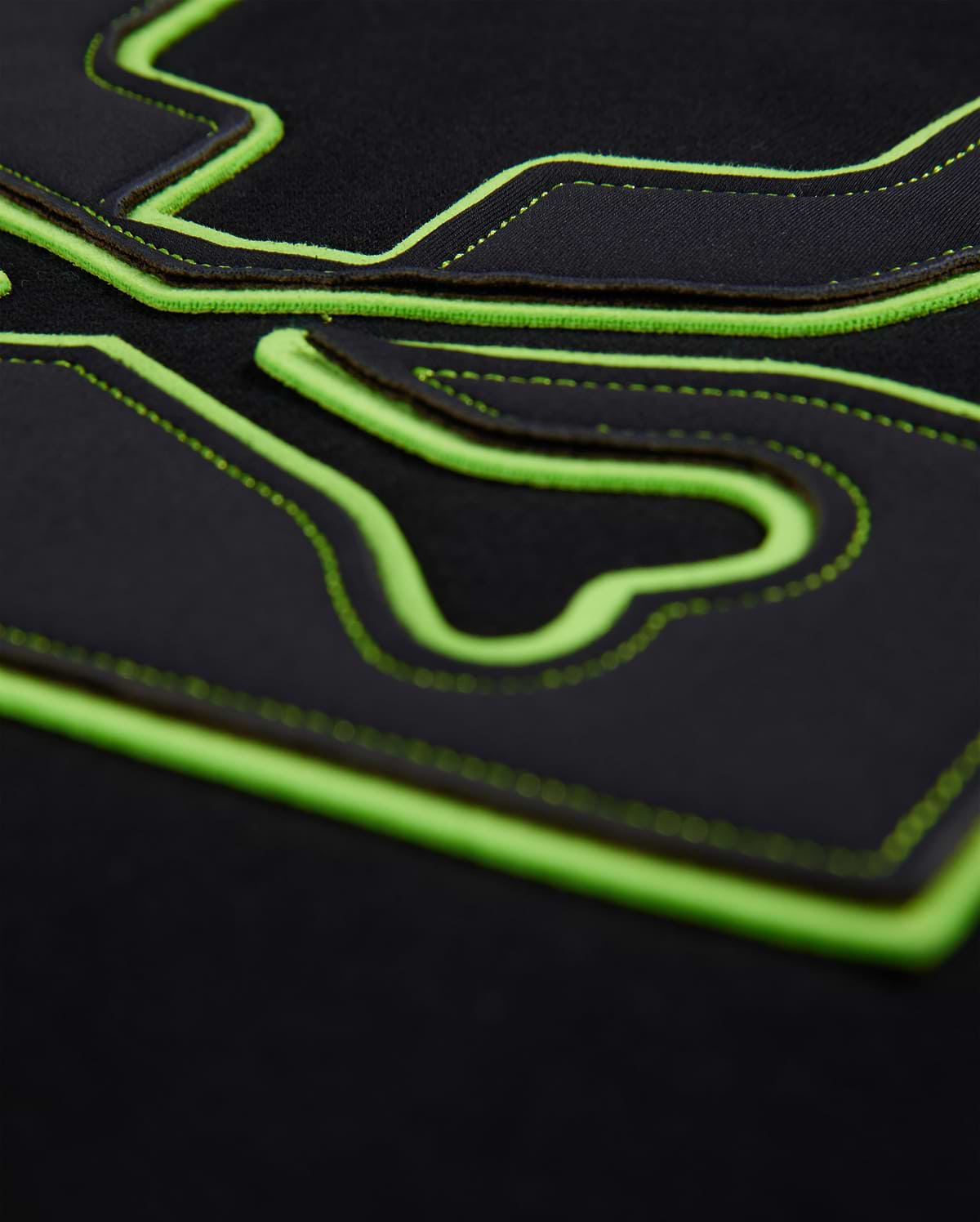 Mens Los Angeles Fleece Sweatshirt in black, featuring a large, raised neon green outline of the iconic Psycho Bunny skull logo with intricate black stitching details on the soft fleece fabric.