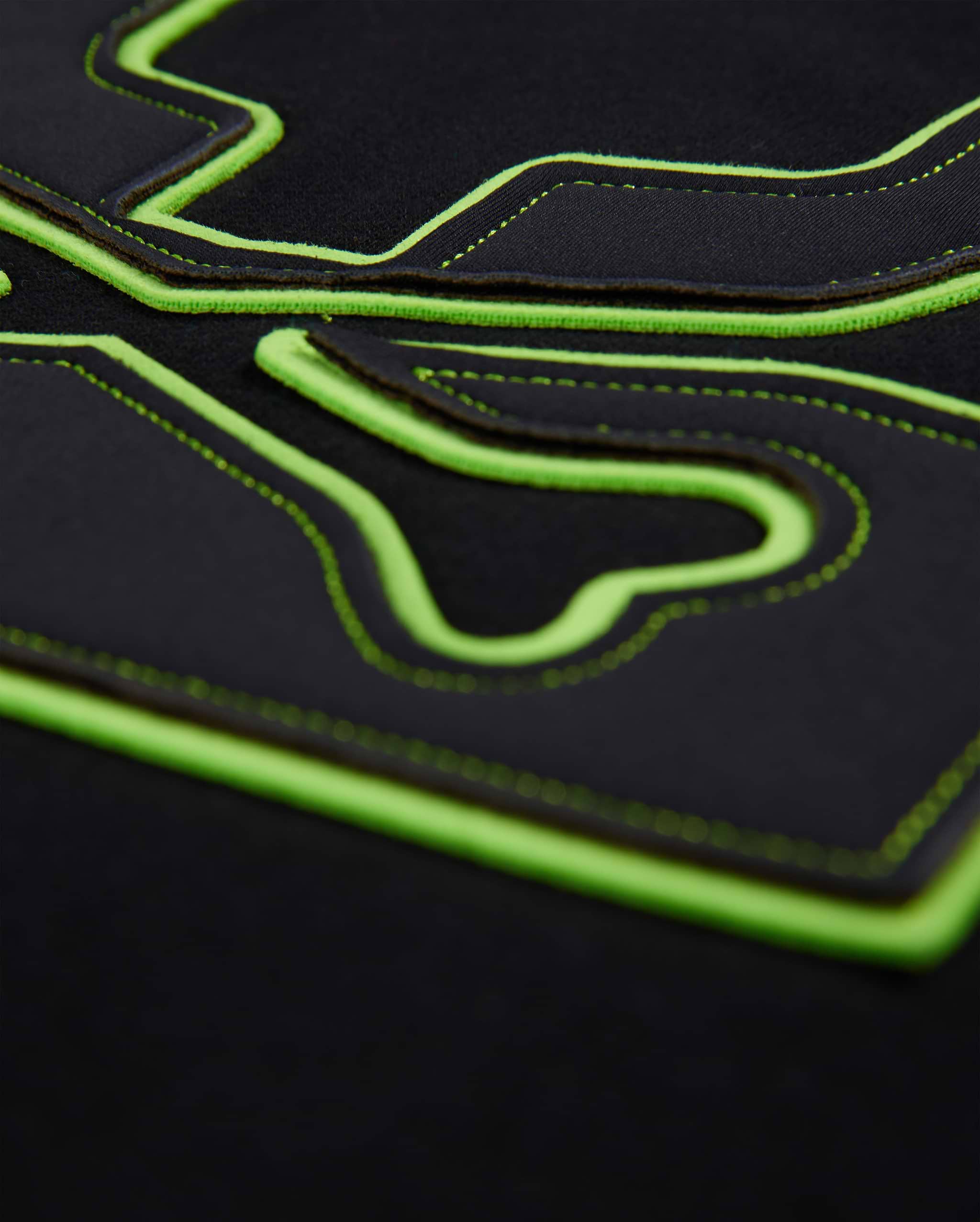 Mens Los Angeles Fleece Sweatshirt in black, featuring a large, raised neon green outline of the iconic Psycho Bunny skull logo with intricate black stitching details on the soft fleece fabric.