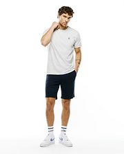 Mens Classic Crew Neck Tee in light grey jersey, featuring a small embroidered Psycho Bunny skull logo on the left chest, styled with navy blue classic fit shorts.