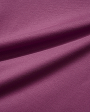 Mens Classic Crew Neck Tee in a luxurious, soft plum-colored jersey knit fabric, featuring subtle folds that highlight its smooth texture and rich, vibrant hue, embodying premium Psycho Bunny style.