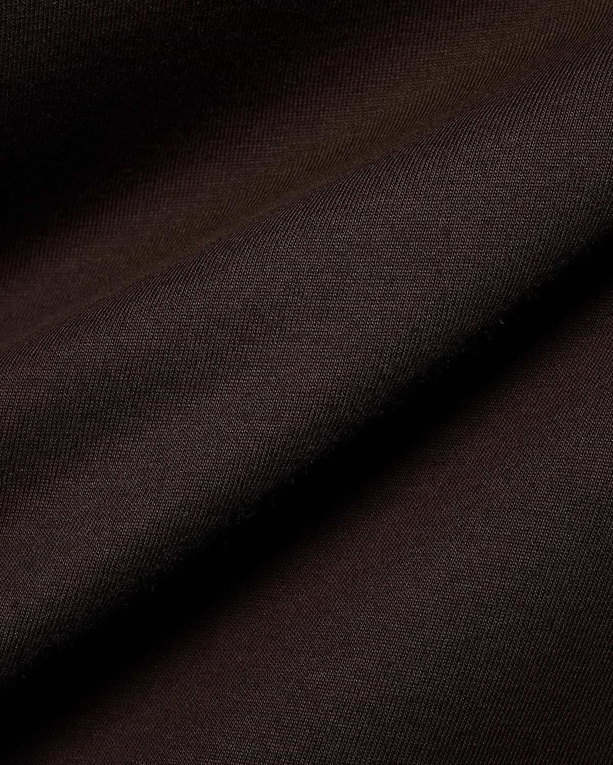 Psycho Bunny Men's Classic Pima Crew Neck Tee in rich dark brown, showcasing its premium Pima cotton jersey knit fabric with a soft, smooth texture and elegant drape. (4)