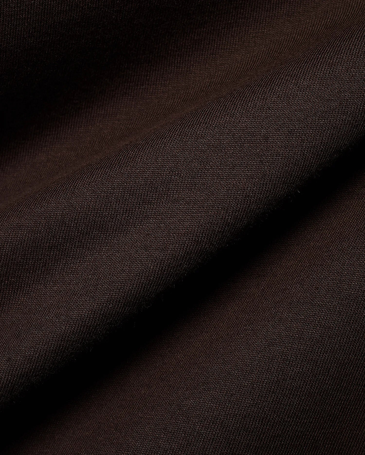 Psycho Bunny Men's Classic Pima Crew Neck Tee in rich dark brown, showcasing its premium Pima cotton jersey knit fabric with a soft, smooth texture and elegant drape. (4)
