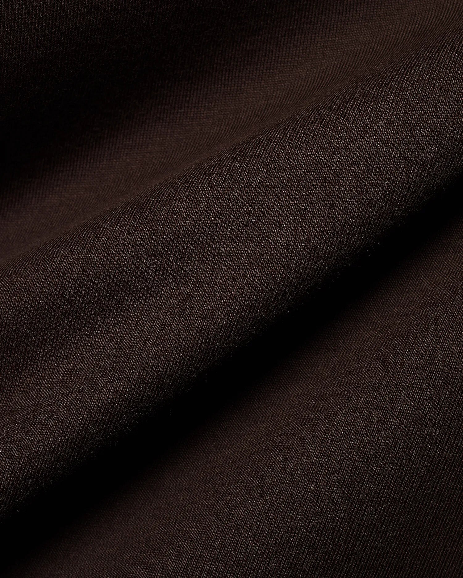Psycho Bunny Men's Classic Pima Crew Neck Tee in rich dark brown, showcasing its premium Pima cotton jersey knit fabric with a soft, smooth texture and elegant drape. (4)