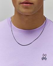 Mens Classic Crew Neck Tee in lavender jersey knit, featuring a classic fit and a small embroidered Psycho Bunny skull logo with pink ears on the left chest.