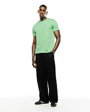 Men's Classic Pima Crew Neck Tee in light green, featuring a classic fit and smooth Pima cotton jersey fabric. A small, embroidered dark blue Psycho Bunny skull logo is on the left chest.