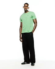 Men's Classic Pima Crew Neck Tee in light green, featuring a classic fit and smooth Pima cotton jersey fabric. A small, embroidered dark blue Psycho Bunny skull logo is on the left chest.