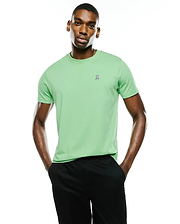 Men's Classic Pima Crew Neck Tee in light green, a classic fit, smooth Pima cotton jersey with a small, embroidered Psycho Bunny skull logo on the left chest featuring white, pink, and blue accents.