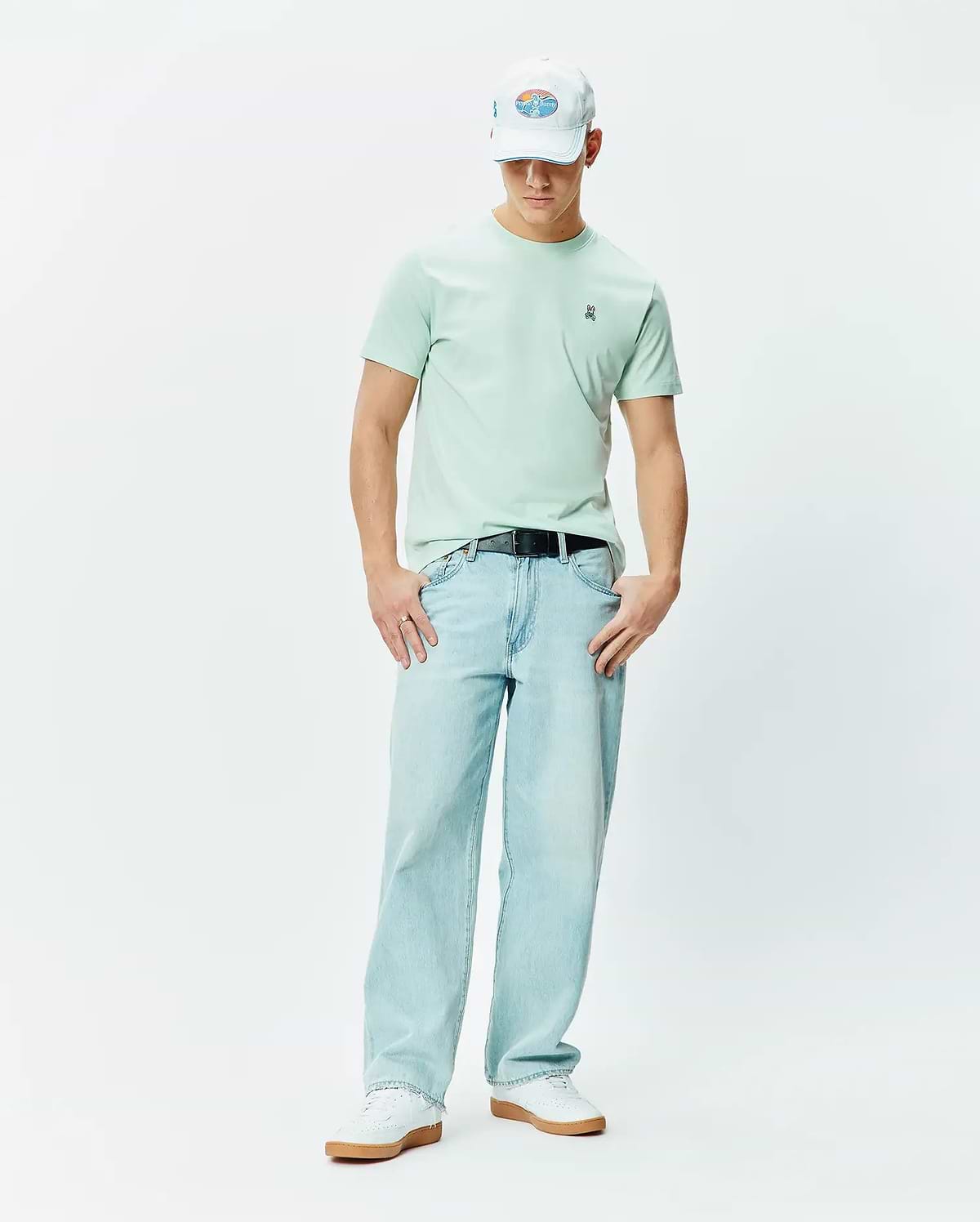 Mens Classic Crew Neck Tee in mint green, featuring a classic fit and soft jersey texture. Small embroidered blue, white, and black Psycho Bunny skull logo on the left chest.
