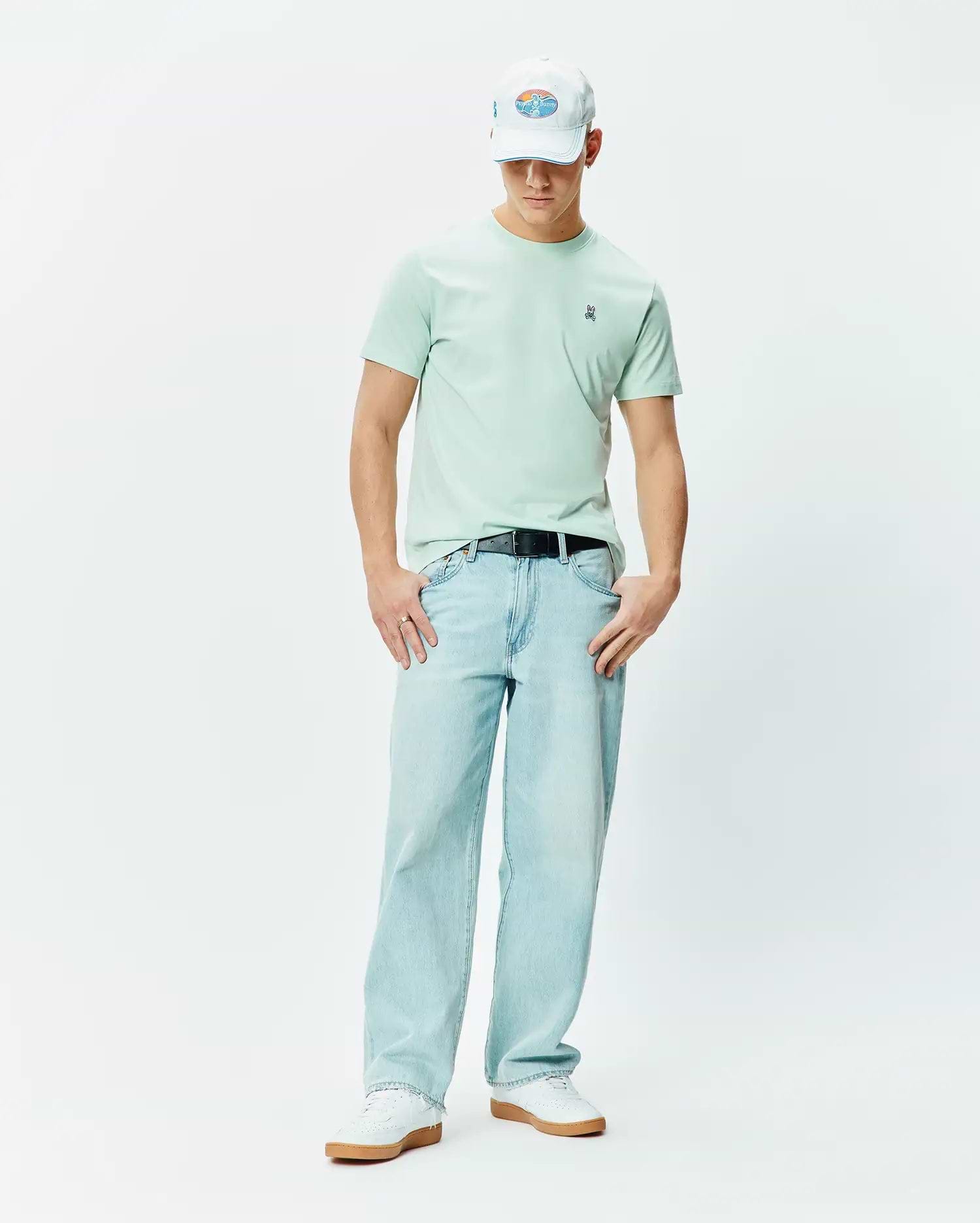 Mens Classic Crew Neck Tee in mint green, featuring a classic fit and soft jersey texture. Small embroidered blue, white, and black Psycho Bunny skull logo on the left chest.