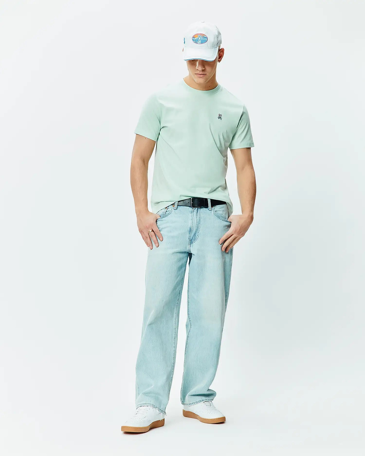 Mens Classic Crew Neck Tee in mint green, featuring a classic fit and soft jersey texture. Small embroidered blue, white, and black Psycho Bunny skull logo on the left chest.