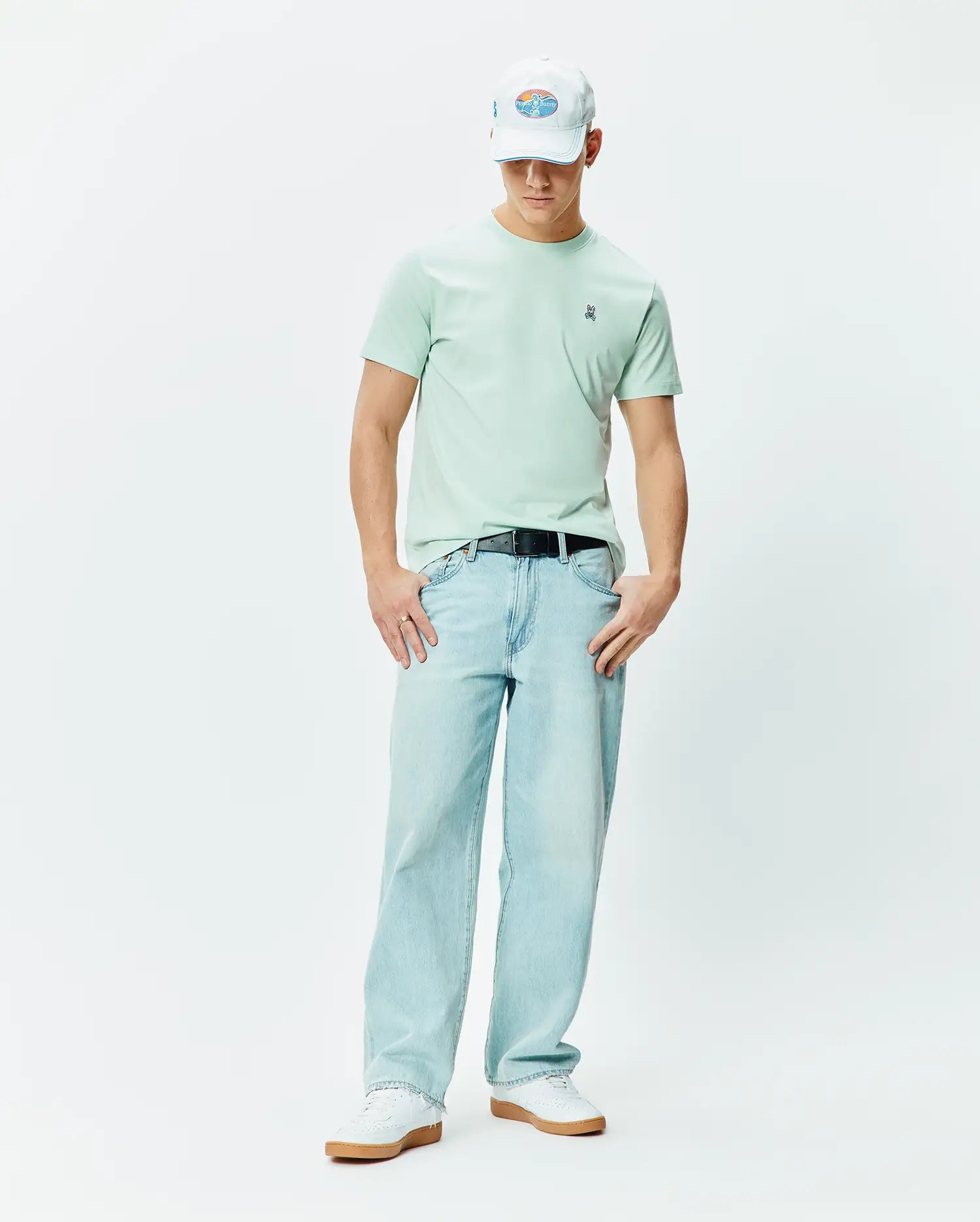 Mens Classic Crew Neck Tee in mint green, featuring a classic fit and soft jersey texture. Small embroidered blue, white, and black Psycho Bunny skull logo on the left chest.