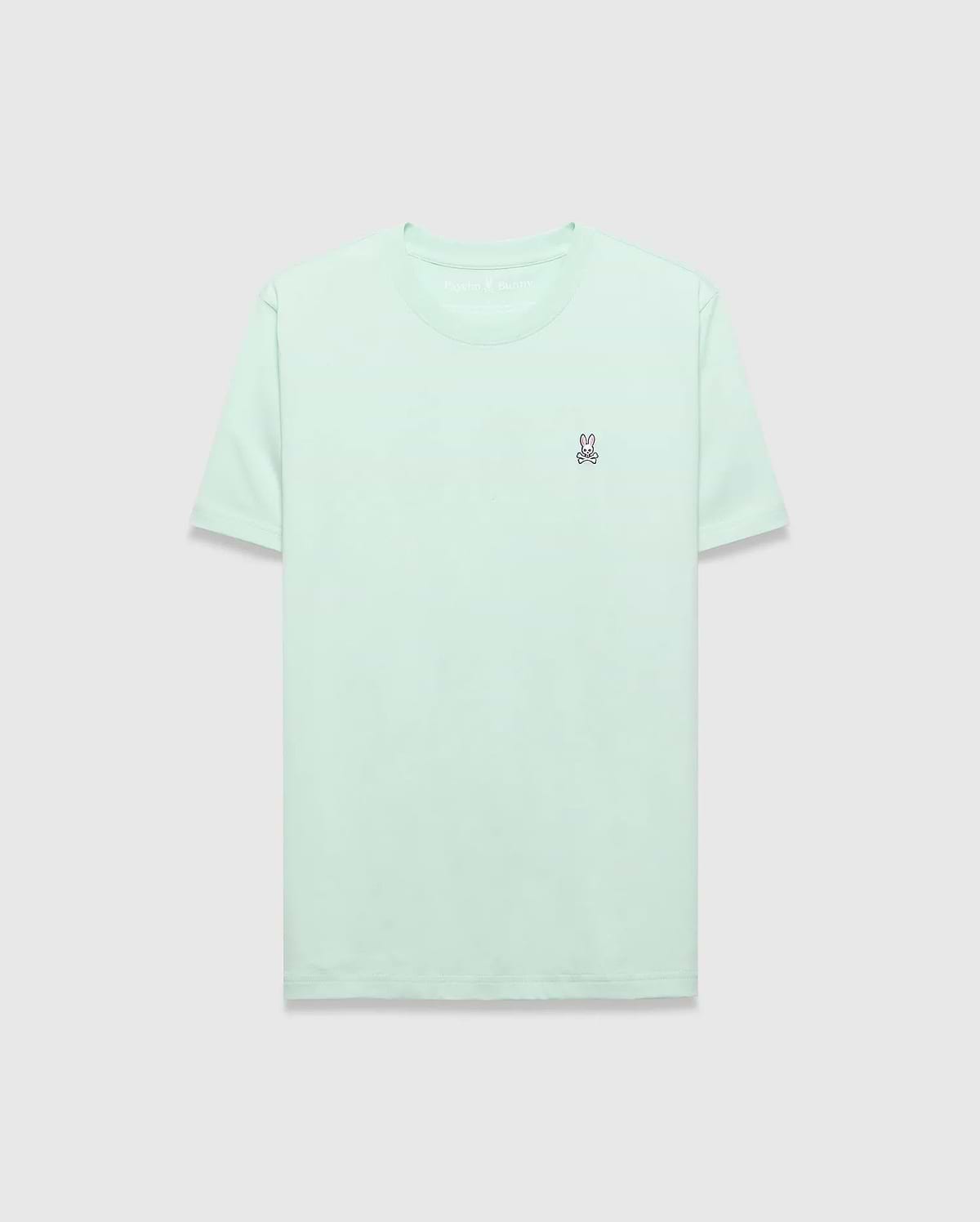 Mens Classic Crew Neck Tee in mint green, featuring a classic fit and soft jersey fabric. A small, embroidered pink and purple Psycho Bunny skull logo is on the left chest.