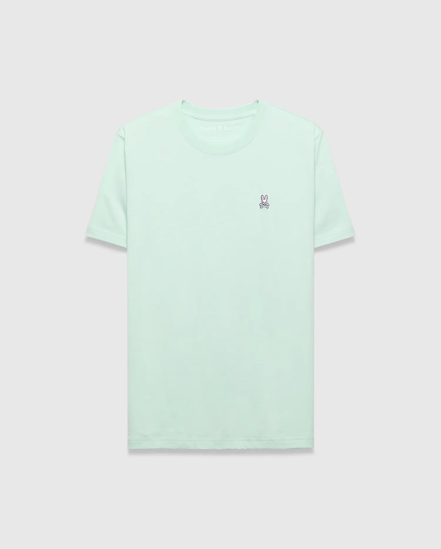 Mens Classic Crew Neck Tee in mint green, featuring a classic fit and soft jersey fabric. A small, embroidered pink and purple Psycho Bunny skull logo is on the left chest.