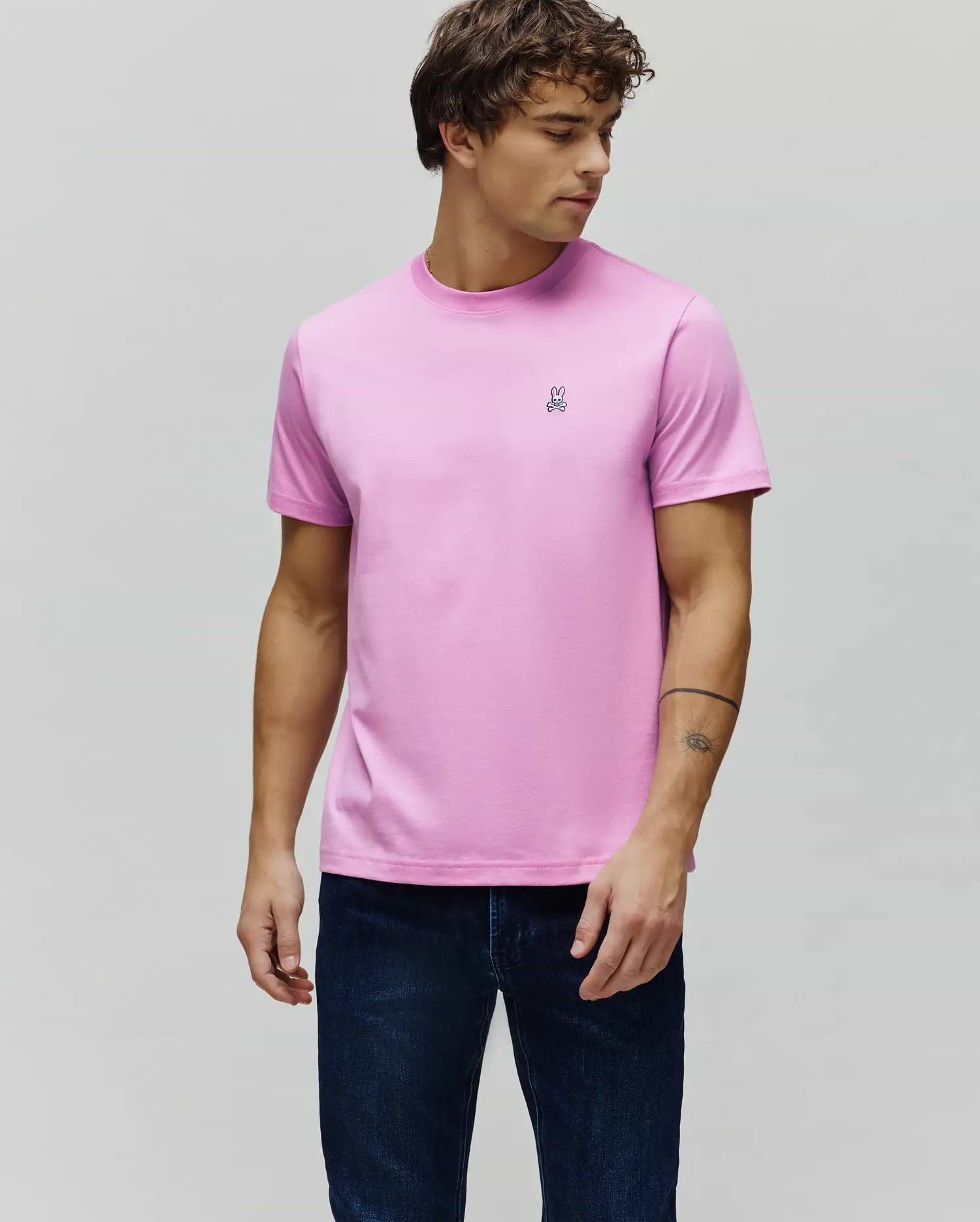 Mens Classic Crew Neck Tee in vibrant pink, featuring a classic fit and smooth jersey knit. A small, embroidered black and white Psycho Bunny skull logo is on the left chest.