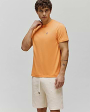 Mens Classic Crew Neck Tee in vibrant orange, featuring a classic fit and smooth jersey fabric, with a small embroidered Psycho Bunny skull logo on the left chest.