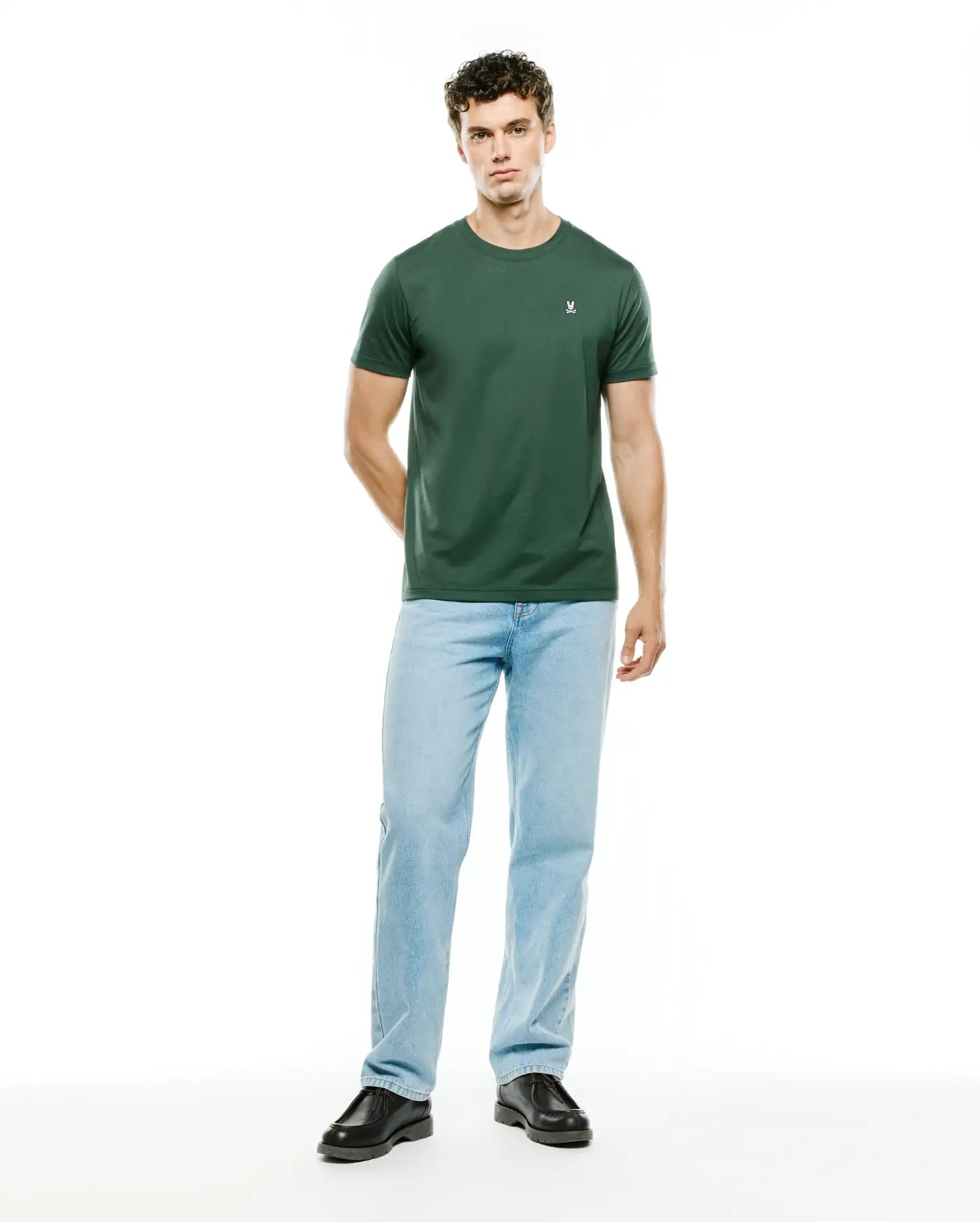 Mens Classic Crew Neck Tee in dark green, featuring a smooth jersey knit fabric and a small white embroidered Psycho Bunny skull logo on the left chest, offering a classic fit.