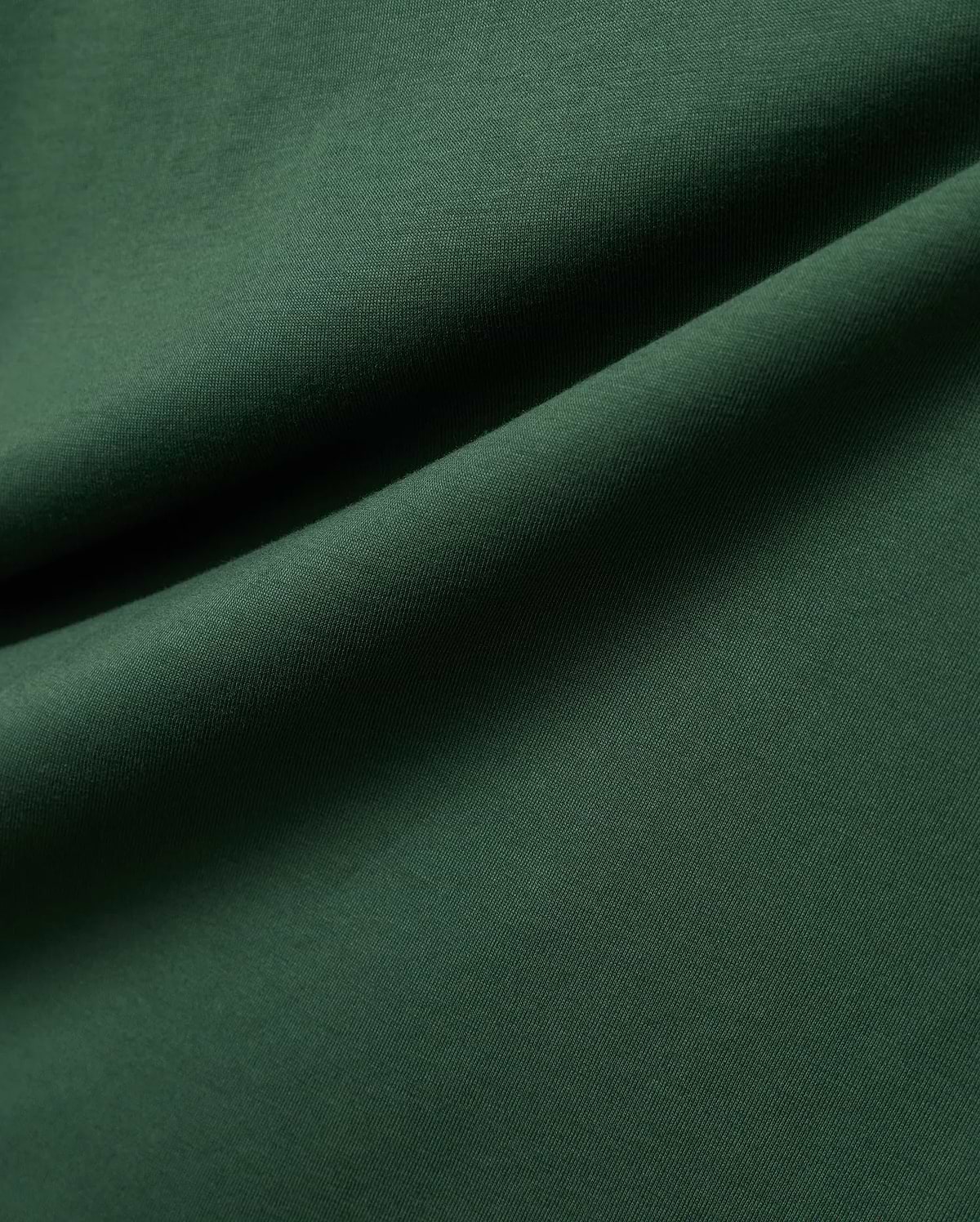 Mens Classic Crew Neck Tee in rich, deep forest green, crafted from premium, soft-touch jersey fabric, showcasing a refined, subtle knit texture and elegant, flowing drapes.