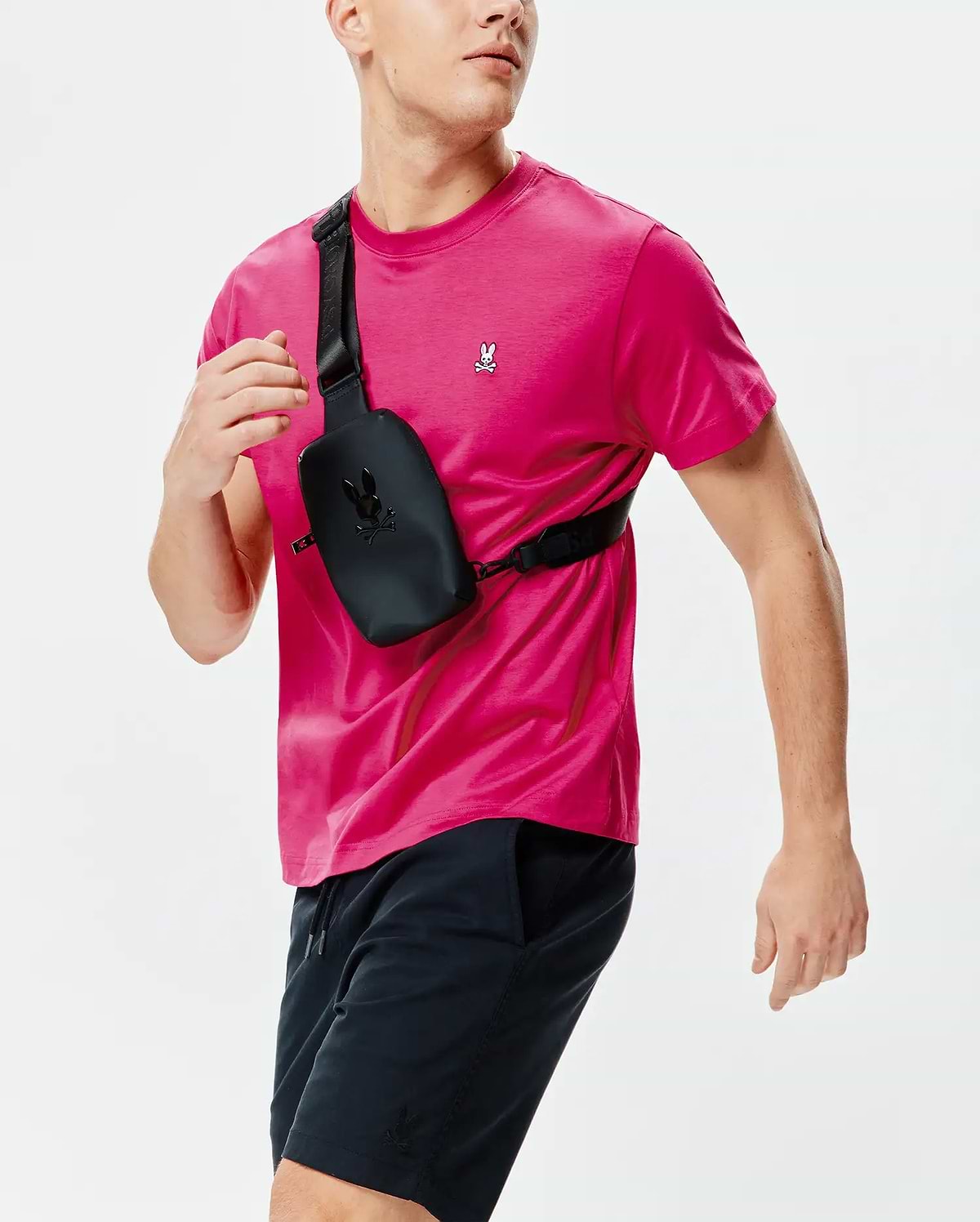 Mens Classic Crew Neck Tee in vibrant hot pink, featuring a classic fit and smooth jersey knit. Small embroidered white and black Psycho Bunny skull logo on the left chest.