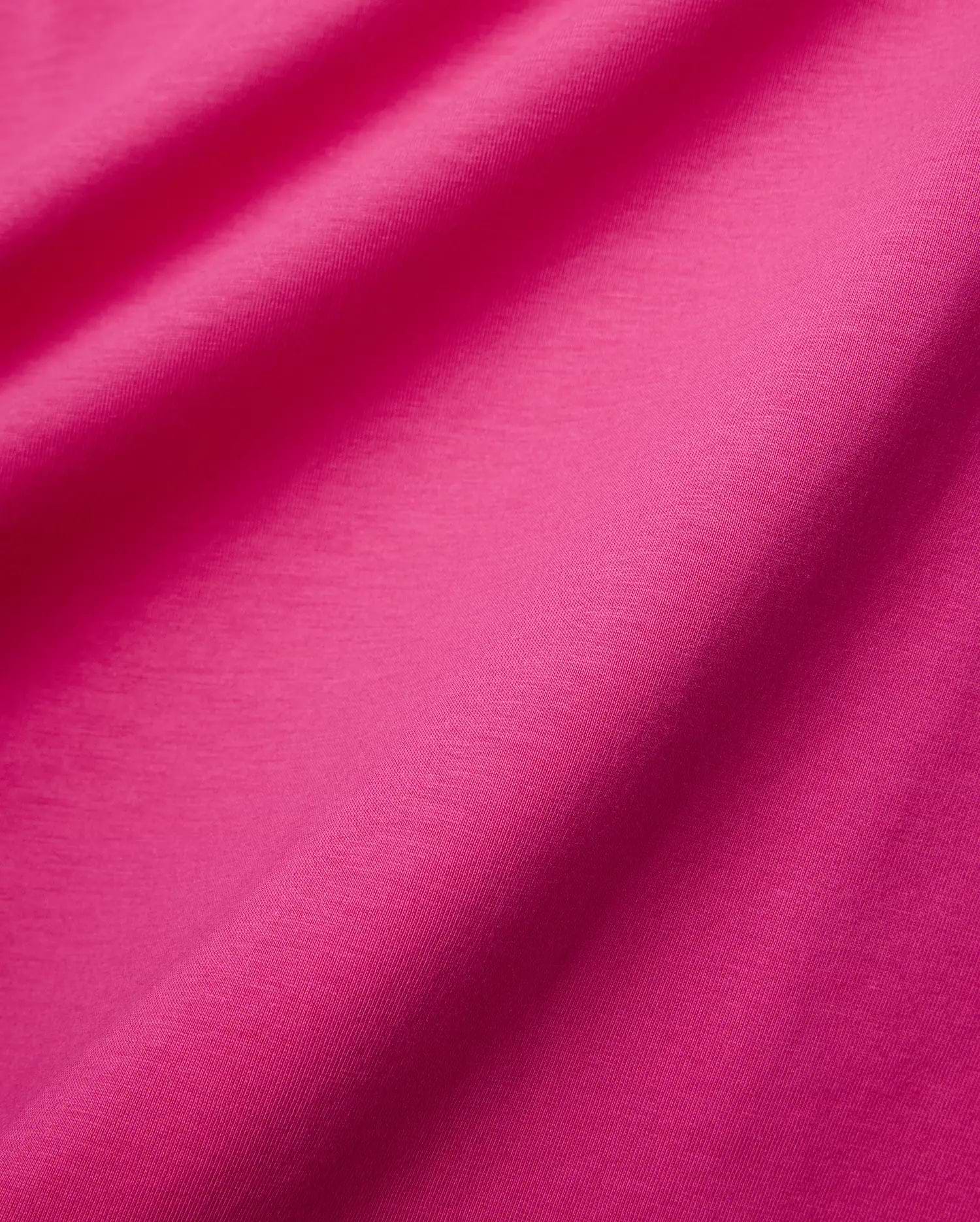 Mens Classic Crew Neck Tee in a vibrant fuchsia, premium jersey knit fabric, featuring a smooth, soft texture with subtle diagonal weave details and elegant draping folds.