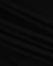 Close-up of the MENS HAWAII CITY TEE - B6U169Y1PC by Psycho Bunny, made from black Pima cotton fabric with a smooth, slightly rippled texture. The dark material displays gentle folds and a subtle sheen, resembling the luxurious quality of a sophisticated men's T-shirt for an elegant appearance.