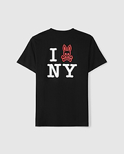 The Psycho Bunny MENS NEW YORK TEE - B6U554W1PC showcases a unique design where the text "I NY" is displayed in bold, white letters on the back of a black tee. The "I" is creatively replaced with an outlined red bunny head featuring a skull and crossbones motif. Constructed from premium Pima cotton, this tee offers a plain white background for added contrast.