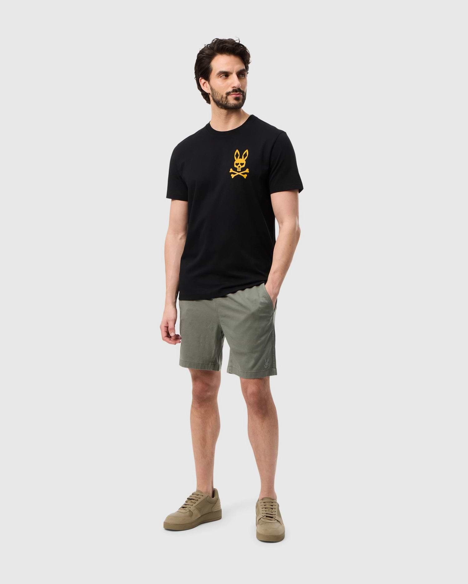 Head to toe view of a model wearing the pima cotton las vegas city tee