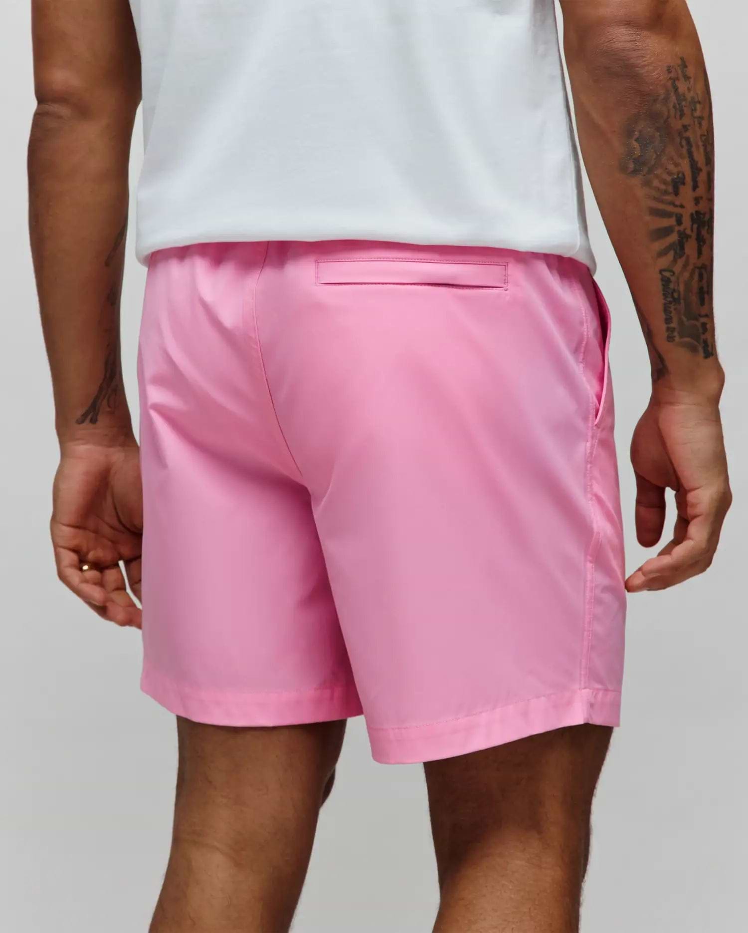 Mens Samos Hydrochromic Printed Swim Trunk in vibrant pink, featuring a smooth, quick-dry fabric, relaxed fit, side pockets, and a single back flap pocket.