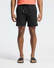 Black Mens Samos Hydrochromic Printed Swim Trunk with a classic fit, featuring a smooth fabric, white PSYCHO BUNNY text on the drawstring, and a small silver bunny skull logo on the lower left leg.