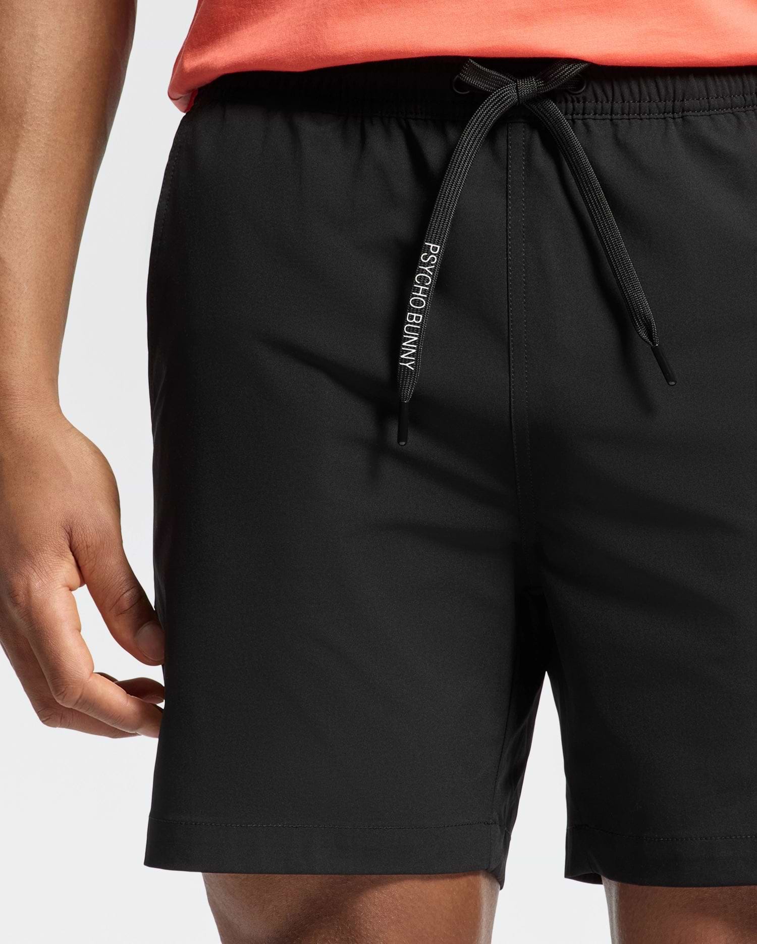 Black Mens Samos Hydrochromic Printed Swim Trunk, a classic fit, smooth quick-dry fabric, featuring an elasticated waist and a prominent black drawstring with white Psycho Bunny branding.